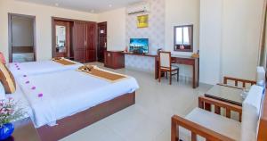 Ένα ή περισσότερα κρεβάτια σε δωμάτιο στο Sunview Beach Hotel Danang