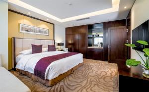 Ein Bett oder Betten in einem Zimmer der Unterkunft 潍坊富华大酒店B座 The Farrington Hotel B
