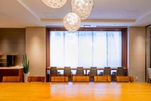a conference room with chairs and a large window at Tokyu Stay Ikebukuro in Tokyo