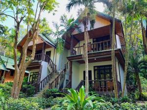 a house in the jungle with palm trees at Dream Valley Resort, Tonsai Beach in Tonsai Beach