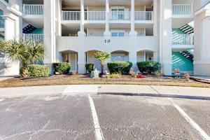 an empty parking lot in front of a building at Golf n' Sea B in Calabash