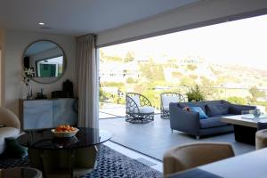 a living room with a couch and a table at Skyline Serenity Luxe Suite-Private Room in Los Angeles