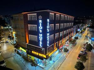 a building with a sign on the side of it at Rio's Hotel AİRPORT in Istanbul