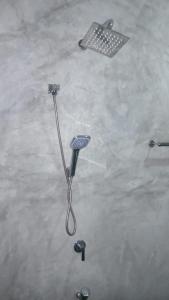 a hair dryer sitting on the floor with other tools at Sri Villa Polwatta in Weligama