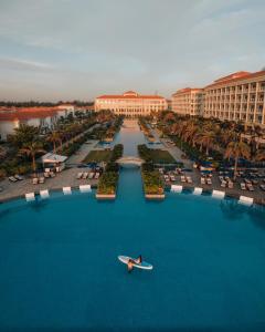 a person on a boat in the water at a resort at Sheraton Grand Danang Resort & Convention Center in Da Nang