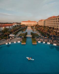 a person on a boat in the water at a resort at Sheraton Grand Danang Resort & Convention Center in Danang