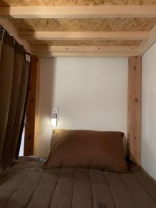 Postel nebo postele na pokoji v ubytování もりぞう
