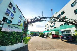an archway over a street next to a building at Green Apartment Kaset in Bangkok