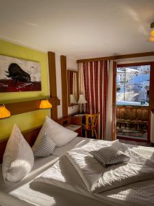 Postel nebo postele na pokoji v ubytování Hotel Tenne