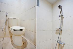 a bathroom with a toilet and a shower at OYO Life 93111 Garden Homestay 2 Merlion in Lontar