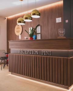 a reception desk in a lobby with a reception pink at Stasa_cozy_nest in Kolašin