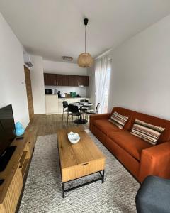 a living room with a couch and a table at Stasa_cozy_nest in Kolašin +13 photos