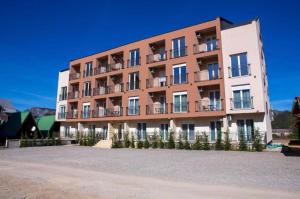 a building with balconies on the side of it at Stasa_cozy_nest in Kolašin