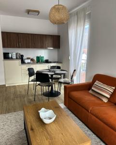 a living room with a couch and a table at Stasa_cozy_nest in Kolašin