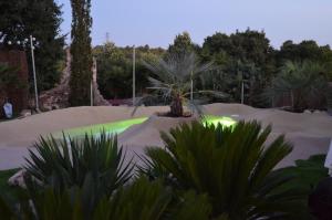 a skate park with a green glow in the sand at Peralta Villas Boutique Adults Only in Renau