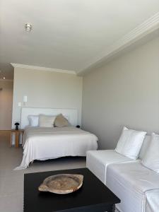 a bedroom with two beds and a tray on a table at Newly Renovated Sunny Studio - 5min Walk to Beach in Sydney