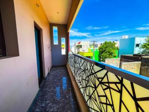 a balcony with a view of a city at Royal Castle Residency in Puducherry