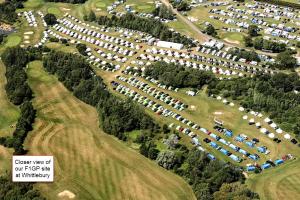 an overhead view of a parking lot with tents at Silverstone Glamping and Pre-Pitched Camping with intentsGP in Silverstone