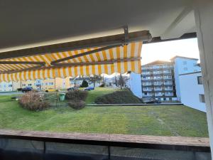 a view of a balcony with a patio umbrella at Frisch renovierte Ferienwohnung in Oberstaufen