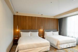Katil atau katil-katil dalam bilik di Home Hotel