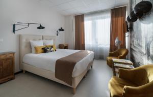 Postel nebo postele na pokoji v ubytování Hôtel Le Grand Barnum