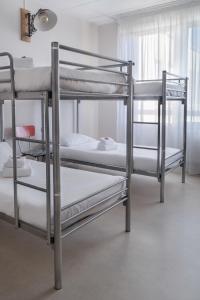 Postel nebo postele na pokoji v ubytování Hôtel Le Grand Barnum