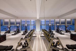a gym with rows of exercise bikes in a room at Hilton Garden Inn Nanjing Hexi Olympic Sports Center in Nanjing