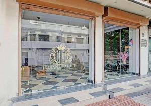 a store window with a sign that reads imperial palace at Hotel Indiana Palace in Kānpur