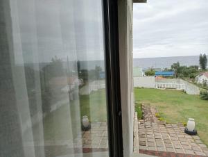 a view of the ocean from a window at La Saville BnB in Scottburgh