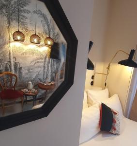 Postel nebo postele na pokoji v ubytování Hôtel Le Grand Barnum