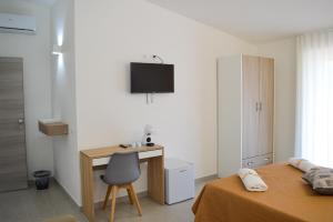 TV a/nebo společenská místnost v ubytování Valle degli Ulivi B&B