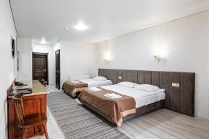 Postel nebo postele na pokoji v ubytování Diamond Resort White