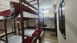 a group of bunk beds in a dorm room at Banaras Gully House 500 ft from The Ghats in Varanasi