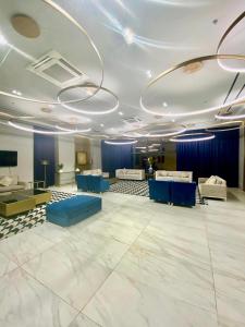 a large room with blue couches and a tv at Studio With balcony in Carreta