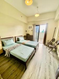 a bedroom with two beds and a window at Studio With balcony in Carreta +8 photos