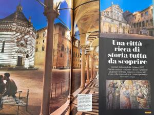 otwartą książkę ze zdjęciem katedry w obiekcie Adua Flat - perfect place for visiting Tuscany w mieście Pistoia