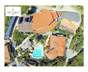 an overhead view of a house with a swimming pool at Eco Hotel Montemerlo in Fetovaia