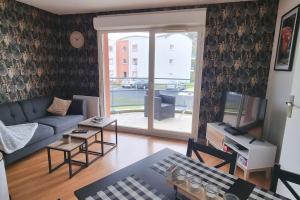 Posezení v ubytování Appartement avec parking privé