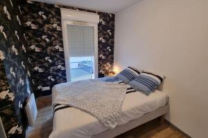 Postel nebo postele na pokoji v ubytování Appartement avec parking privé