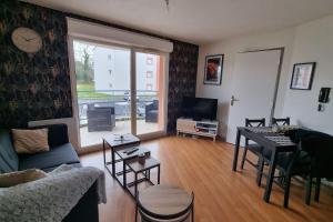 Posezení v ubytování Appartement avec parking privé