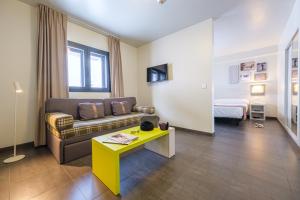 a living room with a couch and a table at Hotel Cristina in Pas de la Casa