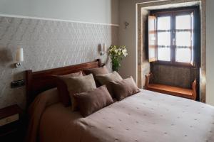 Posteľ alebo postele v izbe v ubytovaní Hostal Pension Artilleiro