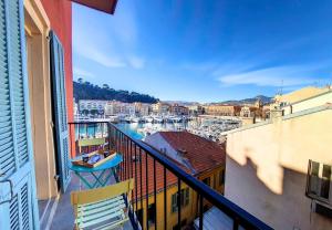 a balcony with a view of a marina at Nestor&Jeeves - REVE BLEU - View Port - BALCONY in Nice
