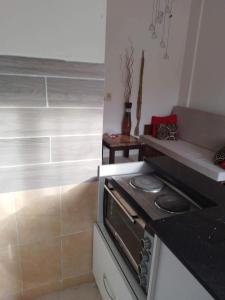 a kitchen with a stove and a counter top at g. ground floor with garden in Hurghada