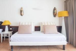 Cama ou camas em um quarto em Tropicanavibes - Vue mer à Sainte-Luce
