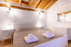 Ліжко або ліжка в номері Casa Vacanze Villa Lorella