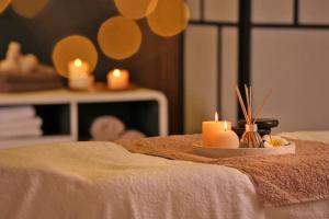 a table with candles on top of a table at SAKURAHANA VILLA AND AYURVEDA in Aluthgama
