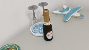 a bottle of champagne in a holder on a wall at B&B le Pontine in Gaeta