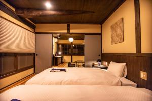 Katil atau katil-katil dalam bilik di NIPPONIA HOTEL Ozu Castle Town