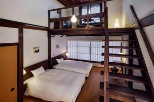 Katil atau katil-katil dalam bilik di NIPPONIA HOTEL Ozu Castle Town